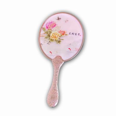 China Personalized cosmetic mirror metal electroplated handle handheld custom hand make up portable 3d modern for sale