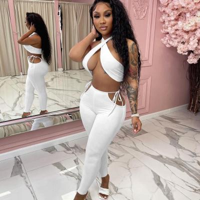 China 2022 breathable hot sale ready to ship solid design ladies sexy clubbing teams crop halter 2PCS top sets two piece pants set women for sale