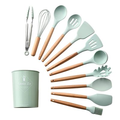 China Sustainable Nonstick Spatula Shovel Silicone Cookware Set Wooden Handle Cooking Tool Kit for sale