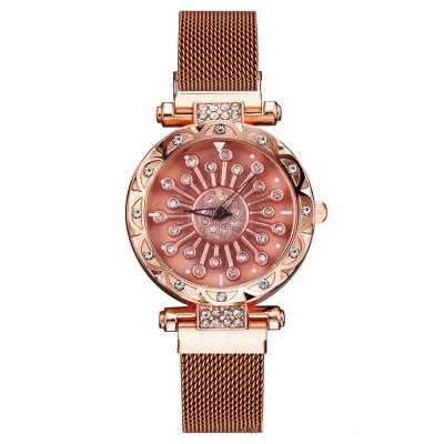 China Hot Selling Magnetic Wrist Diamond Fashion Rotation Dial Watch JAW-0714 Water Resistant Women Ladies Strap Quartz Wrist Watch for sale