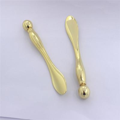 China Wholesale Custom Logo Zinc Alloy Metal Roller Pigment Removal Eye Massager Spoon 10cm Eye Spoon for sale