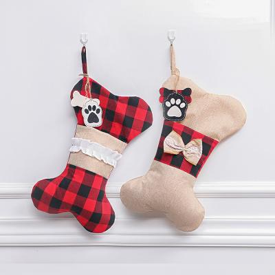 China Hot Selling Christmas Bone Stocking Sack Wholesale Cute Burlap Children Cute Christmas Socks Bone Modeling for sale