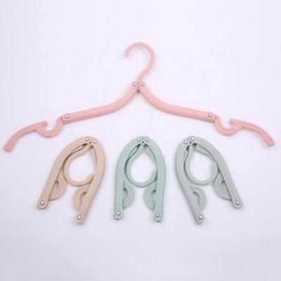 China New Plastic Heavy Duty Folding Hangers Classic/Postmodern Travel Hangers For Wet Clothes Portable Space Saving for sale