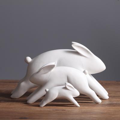 China Minimalist Wholesale Ceramic Three Rabbit Family Ornaments Craft Home Decoration for sale