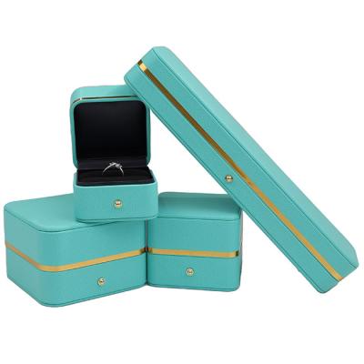 China Jewelry Display Noble Personalized Rounded Corners Exquisite Diamond Packaging Fashion Golden Metal Strip Jewelry Boxes For Wedding Rings for sale