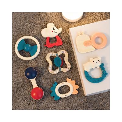 China Cartoon Toy 0-12 Months Infant Plastic Hand Grip Soft Baby Teether Cartoon Ratchets Toys Children Toys for sale