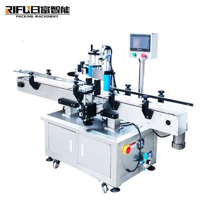 中国 Automatic round bottle flat bottle square bottle labeling machine side positioning labeling machine 販売のため