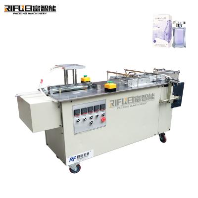 中国 Semi-automatic candy box self-heating hot pot film three-dimensional packaging machine 販売のため