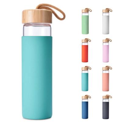 China Mikenda Viable Glass Water Bottle With Silicone Sleeve Wooden Lid Products Hot Selling Glass Bottle for sale