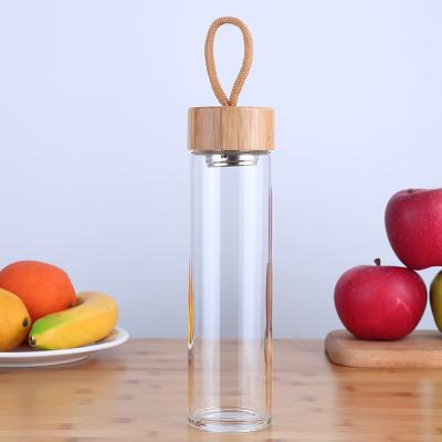 China Mikenda Sustainable Bamboo Lid Glass Water Bottle Customize Logo Glass Bamboo Water Bottle for sale