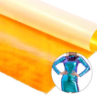 China Shiny Metallic Orange Sparkle Fabric 100 Polyester Iridescent Shiny Illusion Fabric For Evening Dresses Stage Costumes for sale