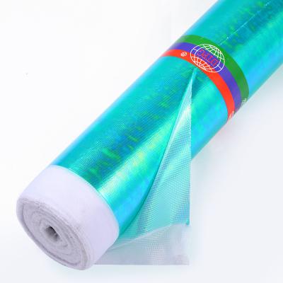 China Shiny Design Metallic Green Sparkle Fabric 100 Polyester Iridescent Shiny Illusion Fabric For Party Dresses Stage Costumes for sale