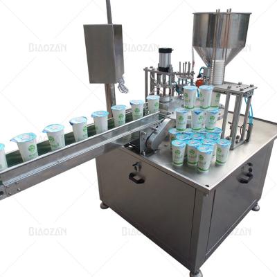 China High Speed ​​Automatic Rotary Type Filling Sealing Machine Jelly Water Cup Sealing Machine Yogurt Cup Food for sale