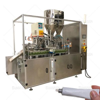 China Food factory quality guaranteed automatic tubes filling sealing machine make 4 color paste in one tube for sale