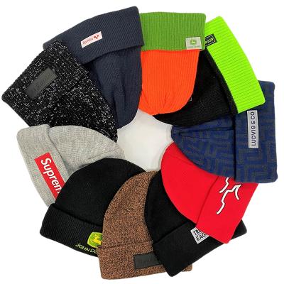 China OEM COMMON Custom Color Rib Knitted Unisex Winter Cuffed Beanie Hats With Embroidered Logo for sale