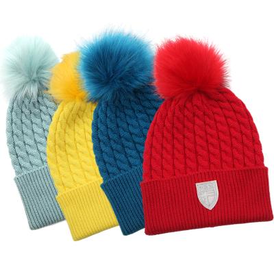 China Customized COMMON Embroidery Patch Cable Knit Colorful Faux Fur Pom Pom Bobble Winter Beanie Hats For Women And Girls for sale