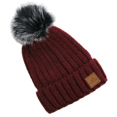 China COMMON Custom Leather Fleece Lined Winter Beanie Toque Adults Brand Patch Hat With Faux Fur Pom Pom for sale