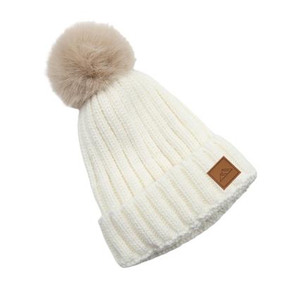 China COMMON Brand High Quality Custom Fleece Striped Winter Thick Knitted Faux Fur Pom Pom Toque Beanie With Leather Patch for sale