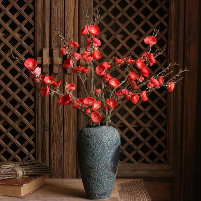 China Simple Simulated Home Decoration Plum Blossom Branch Artificial Flowers High Simulation Wintersweet Flower Decoration for sale