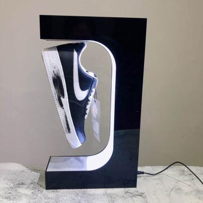 China Magnetic Levitation Handmade Rotating Floating Sneakers Display Rack Stretch Creative Acrylic LED Lighted Shoe Box for sale