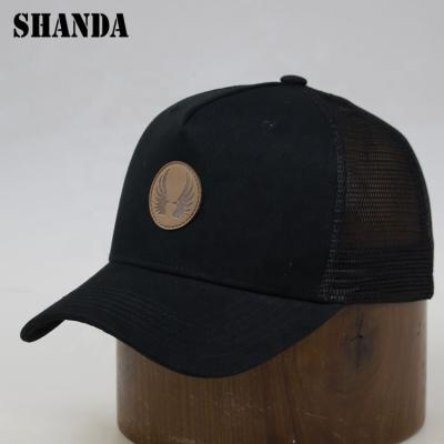 China 2019 Wholesale COMMON Black Cotton Trendy Snapback Embossed Faux Leather Patch 5 Panel Trucker Hat for sale