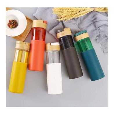 China Glass Water Bottle Stocked With Silicone Sleeve Water Bottles Glass With Custom Logo Glass Bottle For Water With Handle Bamboo Lid for sale