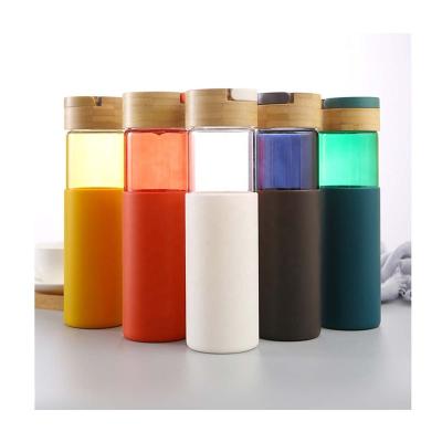 China Unbreakable Glass Water Bottle Stored Gradient Portable Heat Resistant Colorful Glass Water Bottle With Handle Lid for sale