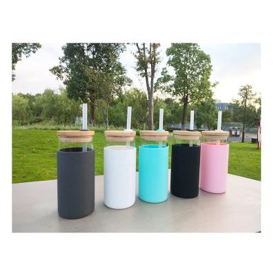 China 600ml borosilica bamboo shatterproof silicone stocked glass crystal water bottles with silicone cover lid bamboo top straws for drinking for sale