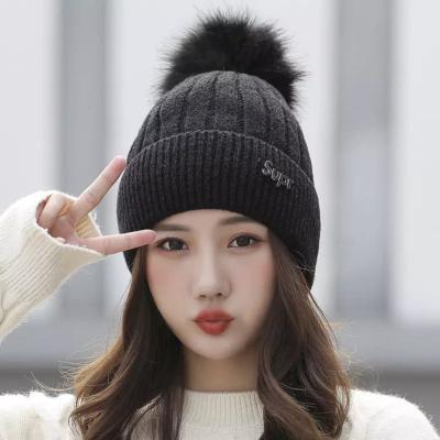 China 2022 Factory COMMON Wholesale Custom Cheap Winter Hat Knitted Winter Hat Polka Dot Warm Knitted Hat With Leather Logo for sale