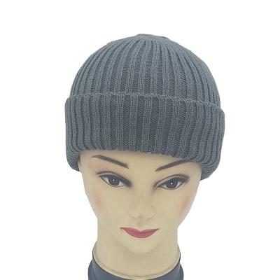 China 2022 Factory COMMON Wholesale Custom Cheap Winter Hat Knitted Winter Hat Polka Dot Warm Knitted Hat With Leather Logo for sale