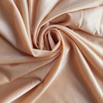 China Stretch warp to knit soft hand to feel compression 70 nylon spandex top 30 fabric shiny shapewear fabric for sale