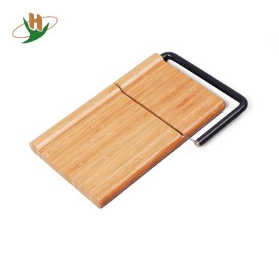 China Viable Original Personalized Wooden Countertop Bamboo Cheese Cutting Board With Wire Cheese Slicer for sale