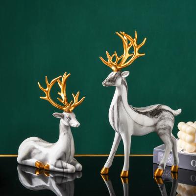 China Nordic Europe luxury marble and gold elk open living room decoration resin open sculptures animal decor for sale