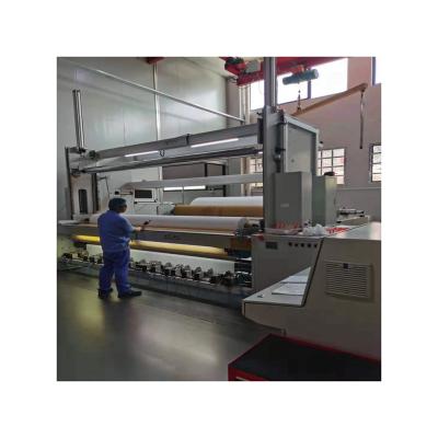 China Automatic 380v Automatic Nonwoven Bobbin Winder Fusing Nonwoven Wadding Machine for sale