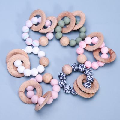 China Toy Hot Sale Silicone Soft Teether Customized Make Wooden Teether Ring Baby Gift Set Silicone Baby Teether for sale