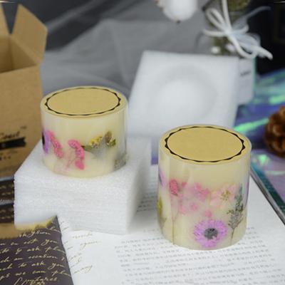 China Luxury Unique Wholesale Pillar Scented Candles With Dried Flowers Inside Luxury Custom Color for sale