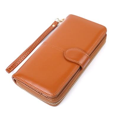 China Eco-friendly RFID AZB095 Cateras Femininas PU Leather Bi-fold Clip Long Wristband Women Zipper Wallets for sale