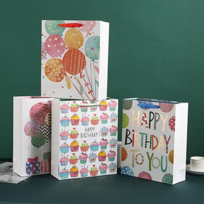 China Recyclable Custom Colored Printing Custom Luxury Shopping White Cardboard Gift Paper Bag Kids Birthday Party Paper Bags for sale