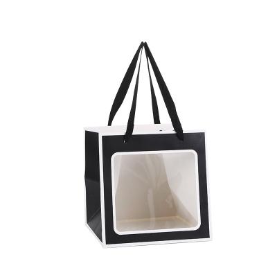 China Creative Wholesale Recyclable Flower Paper Bag Bouquet Waterproof Handbag With Clear PVC Window for sale