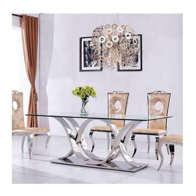 China Unveiled Luxury Glass Home Dining Tables Furniture Stainless Steel Dining Table Modern Marble Dining Table 4 Seater Dining Table Designs for sale