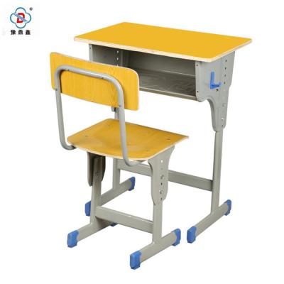 China Modern Yellow Metal Top Leg Height Adjustable MDF School Desk for sale