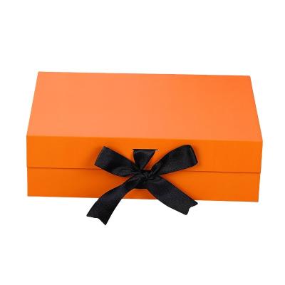 China Logo Design Large Color Magnetic Disposable Cardboard Box Creative Custom Rigid Shipping Gift Boxes Clothes Folding Box With Ribbon Bow for sale