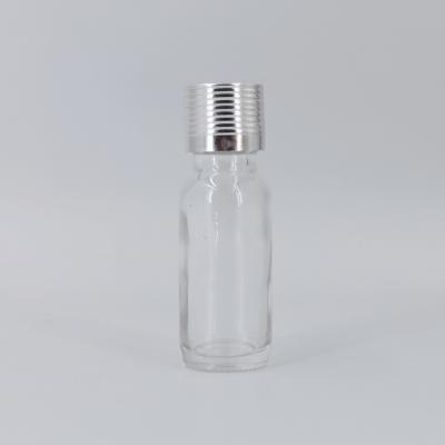 China Personal Care Clear 0.5oz Essential Oil Boston Glass Cosmetic Bottle With Gold And Silver Cap for sale