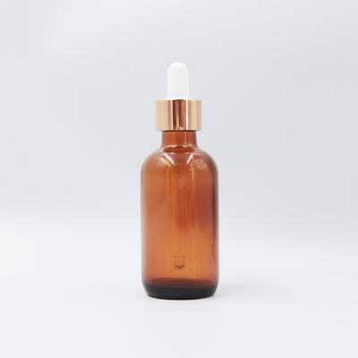 China Personal Care Wholesale 2oz 60ml Boston Amber Glass Bottle With Gold And Black Dropper for sale