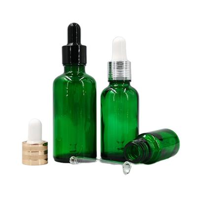 China Personal Care 30ml Green Glass Dropper Bottles For Essential Oil Packaging for sale