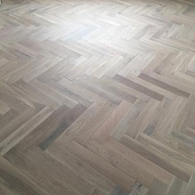 China Modern Gray Brushes Full Solid Oak Herringbone Wood Flooring for sale