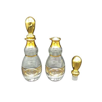 China Personal Care 100ml 150ml Gold Silver Paint Glass Decanter For Essence Perfume Oil Display for sale