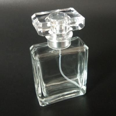 China Clear 30ml 50ml square crystal glass empty rectangular personal care perfume bottle with acrylic cap and aluminum sprayer for sale