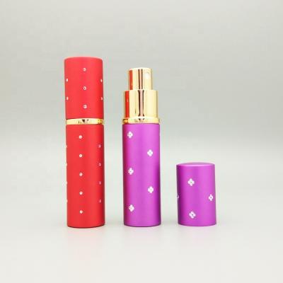 China High Quality Purple Mini Easy Refill Personal Care Round Pocket Aluminum Perfume Bottles 10ml 15ml With Pump Sprayer for sale