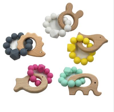 China Non-Toxic Wholesales Baby Wooden Infant Teether Beaded Animal Charm Chewing Toy Teething Bracelet for sale